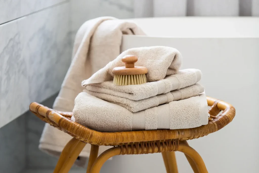 Spa like bathroom with soft neutral towels and natural textures