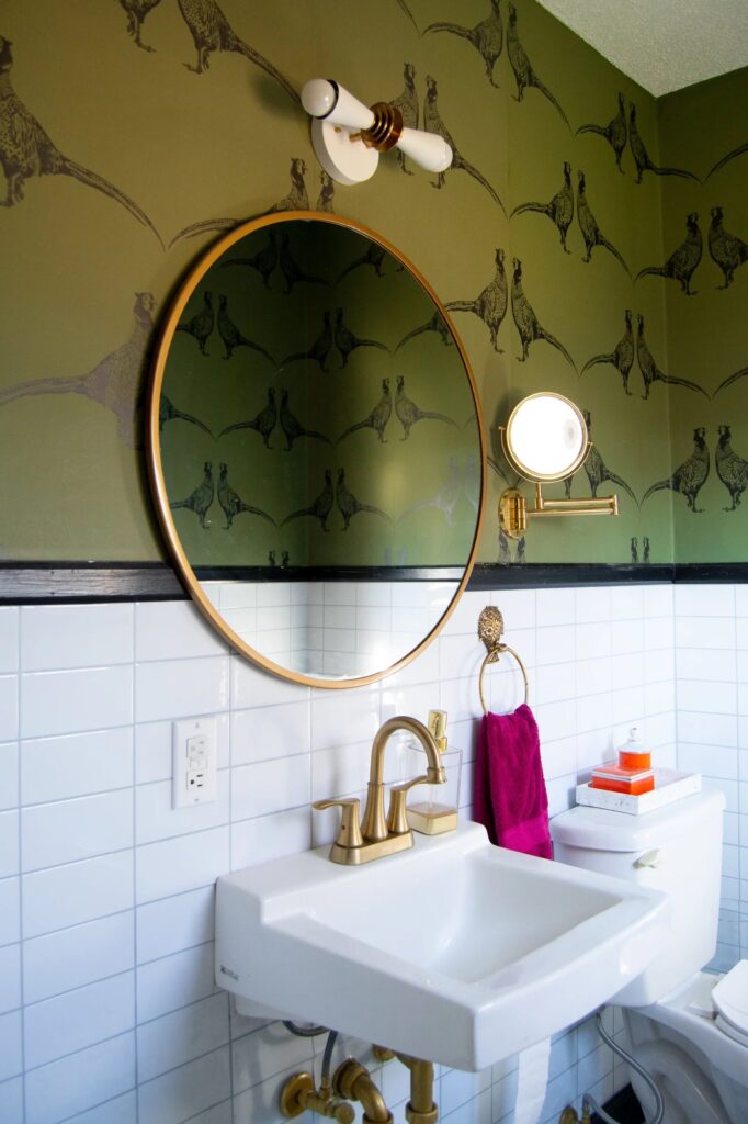 Bathroom with white subway peel and stick tiles behind vanity