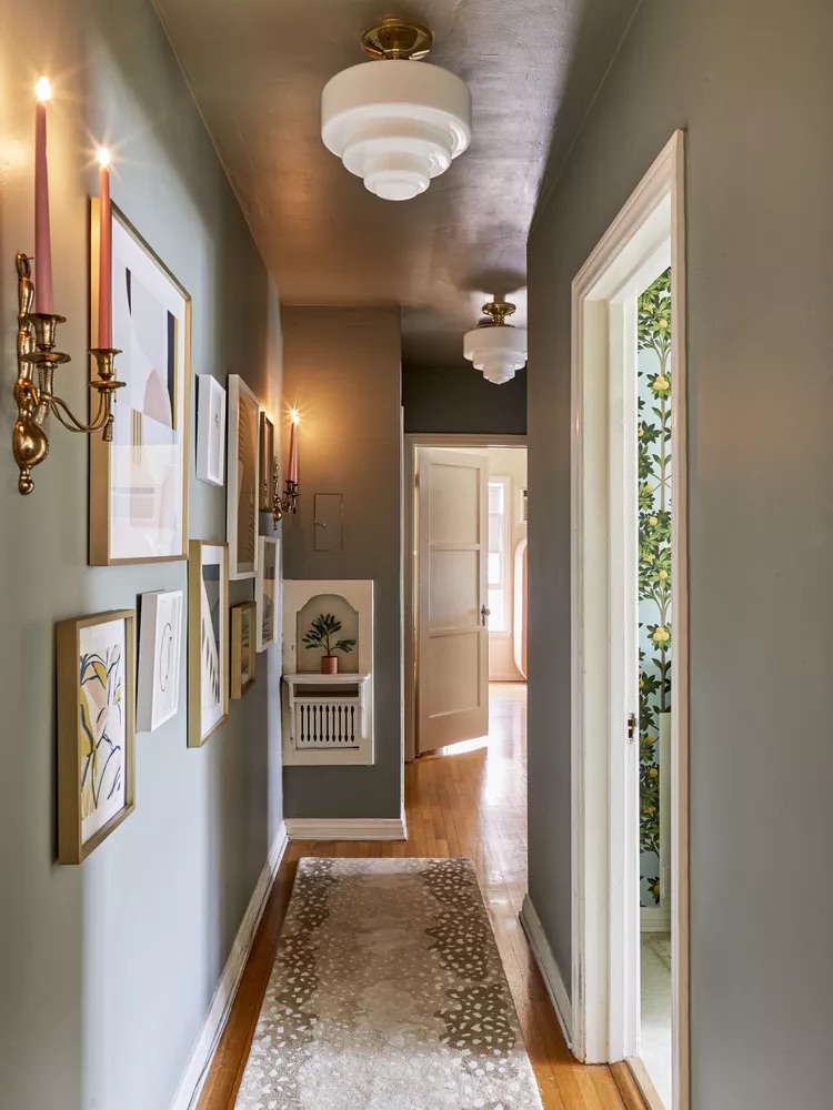 Entryway with vintage inspired glass light fixture casting warm diffused light