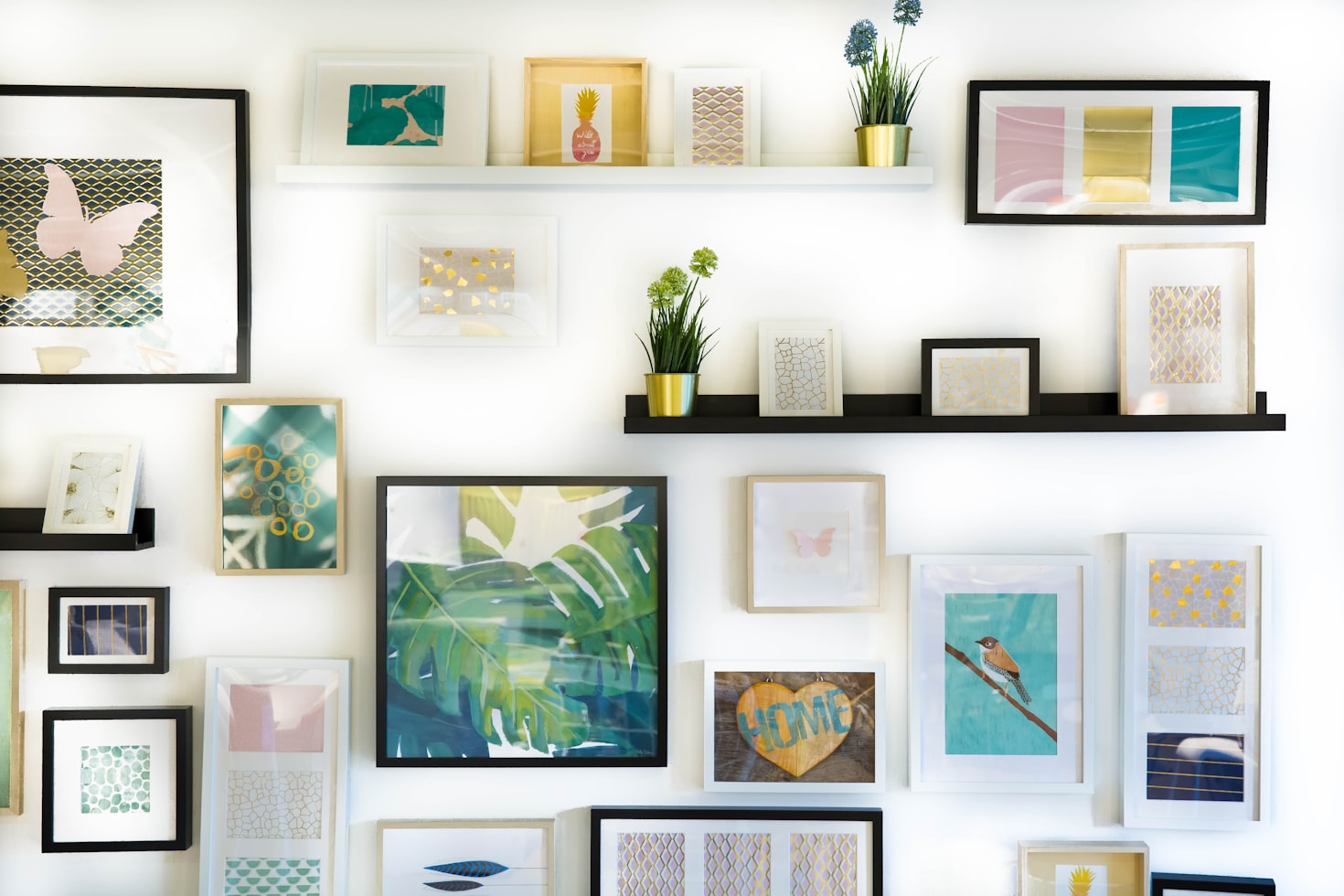 Minimal gallery wall in a small apartment with neutral frames and warm tones