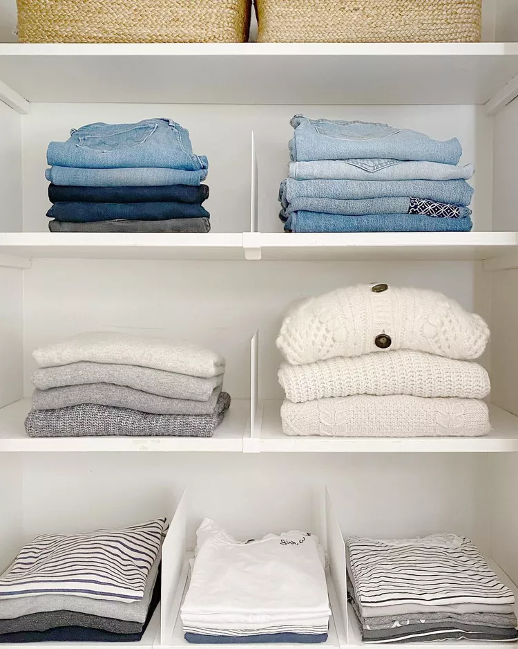 Renter friendly shelf dividers clipped onto closet shelves keeping folded clothes neatly separated