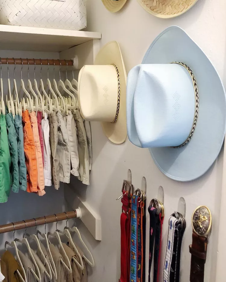 Renter friendly closet organization with hooks holding bags scarves and accessories