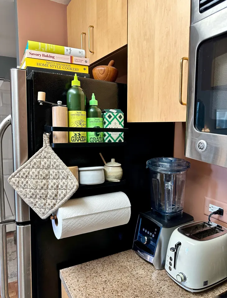 Small organized kitchen with clear counters and smart vertical storage