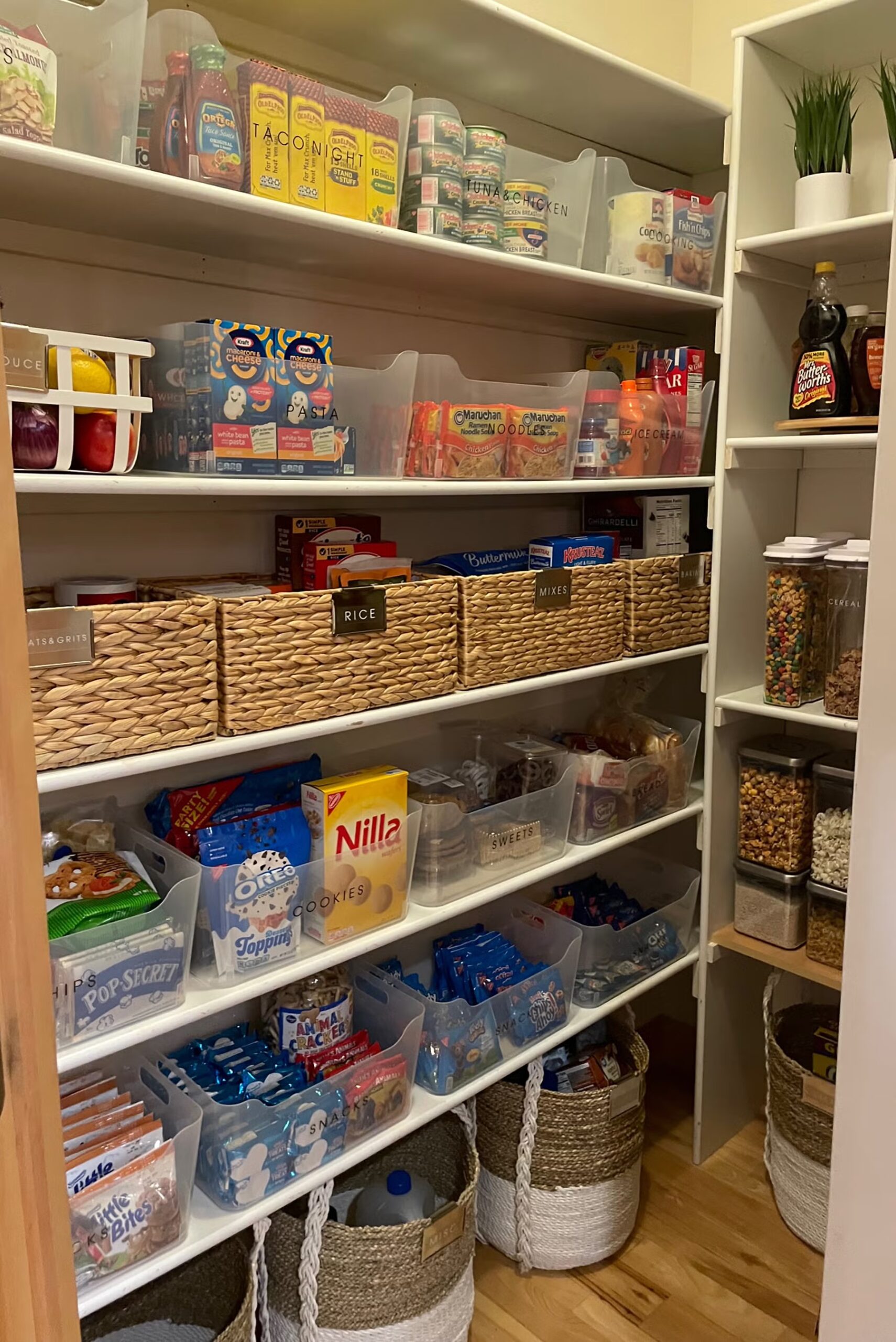 Pantry storage baskets grouping snacks and dry goods by category