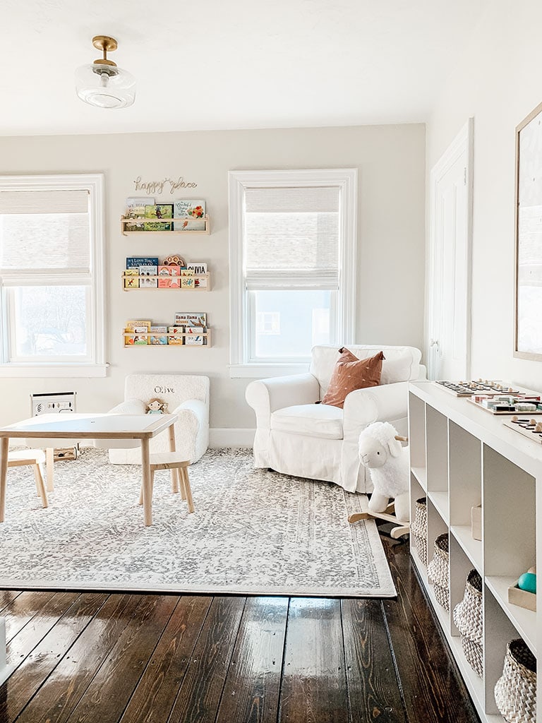 Calm neutral toy free living room in a small apartment with minimal decor