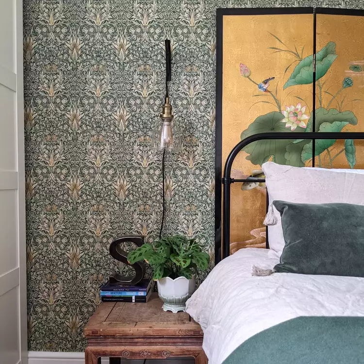 Bedroom with peel and stick wallpaper accent wall in warm neutral tones