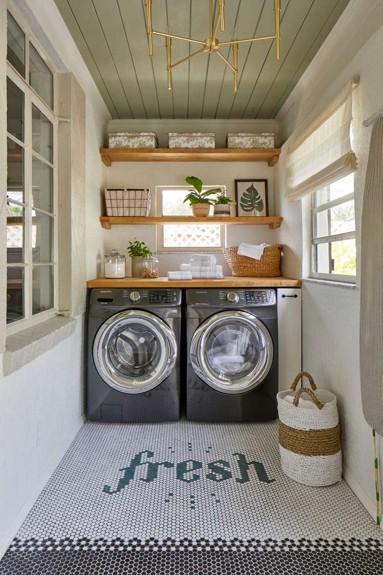 Small organized laundry room with over washer shelf and neatly stored detergent