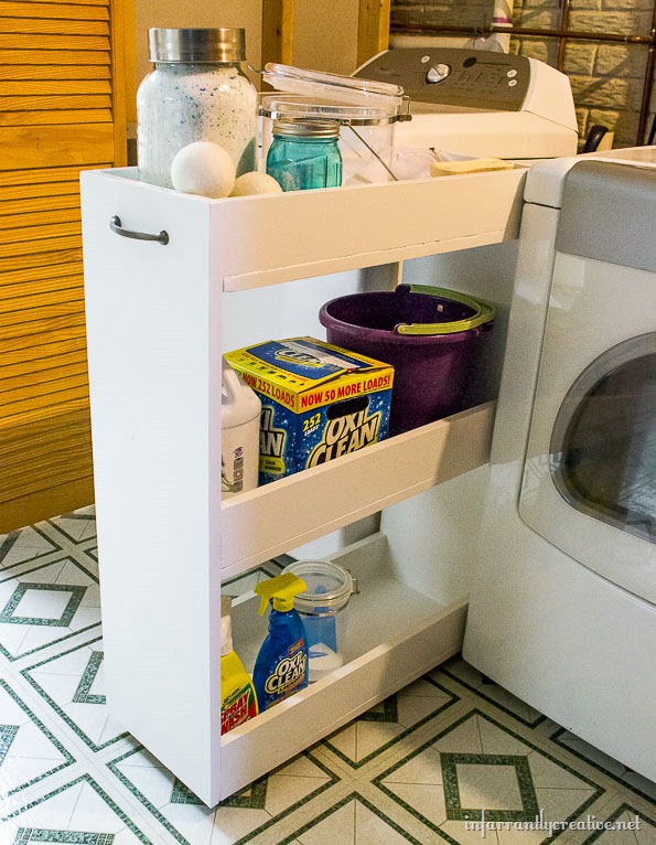 Slim rolling cart between washer and wall in a small laundry room