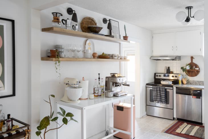 Small apartment coffee corner on a cart with styled mugs coffee machine and warm neutral decor