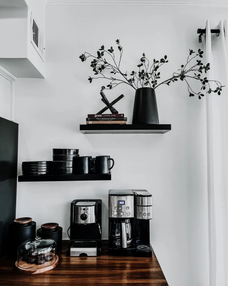 Cozy styled coffee corner with personal details plant candle and warm decor