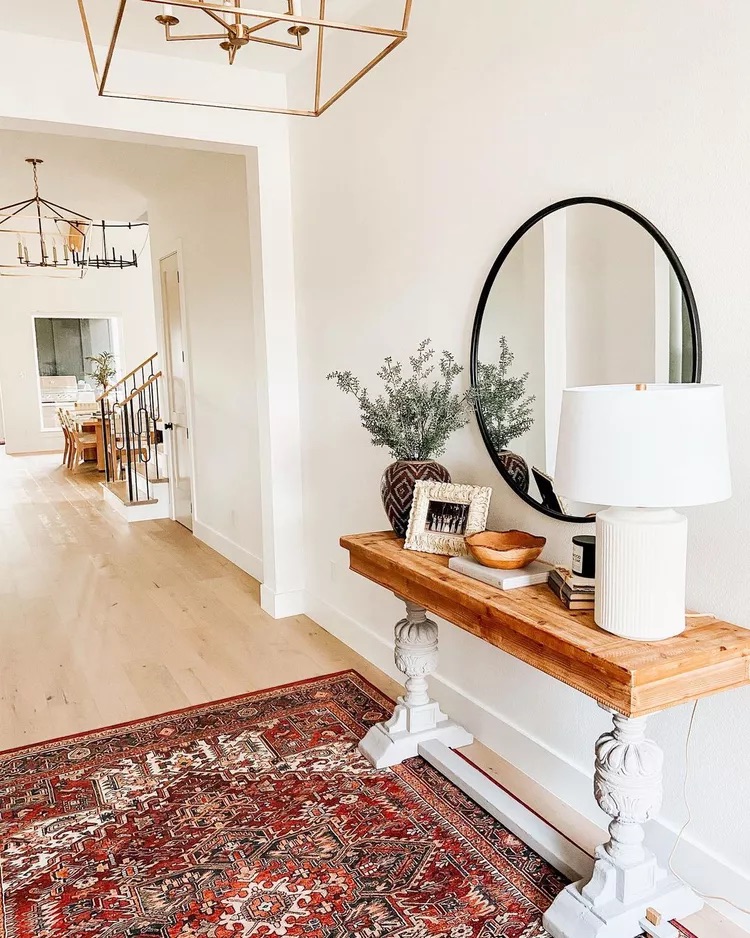 Small entryway table with a warm ceramic table lamp creating a cozy welcoming entrance