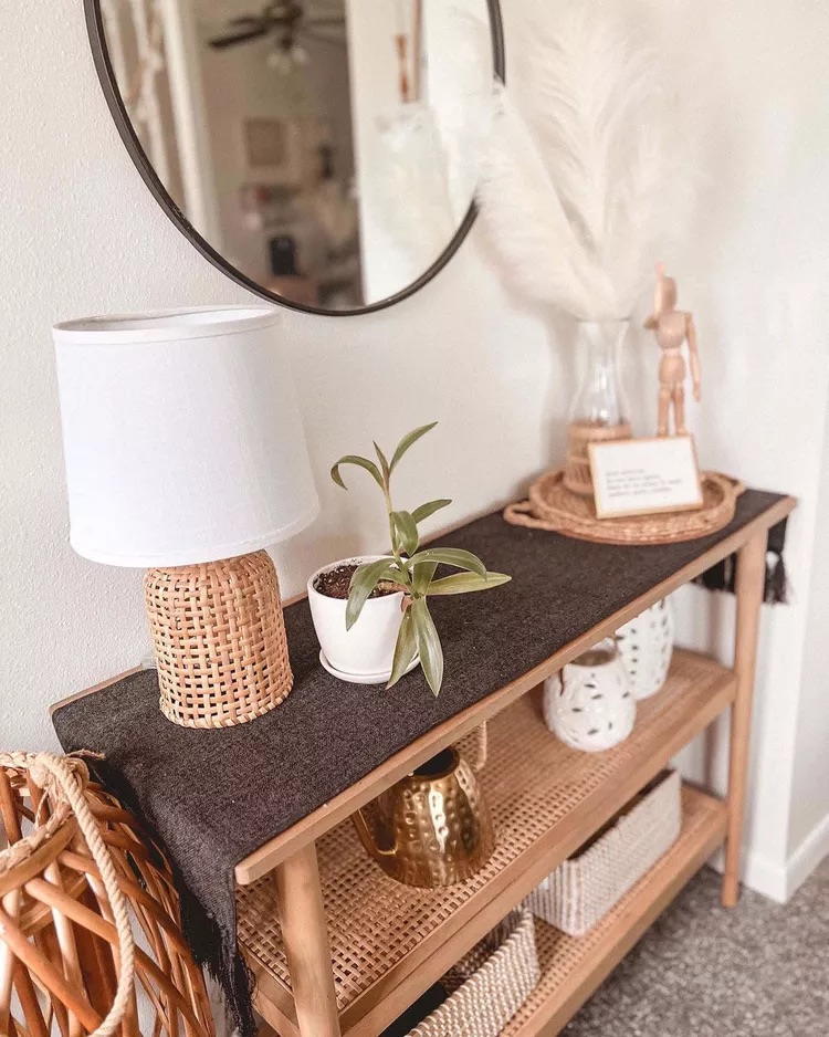 Decorative tray on entryway table holding keys and small essentials in a styled arrangement
